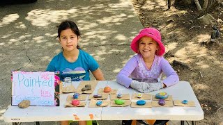 Girls selling their painted rocks :)