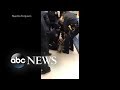 Video shows officers in tug-of-war with mother over baby