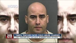 Teacher arrested for shoving, spitting on student during class