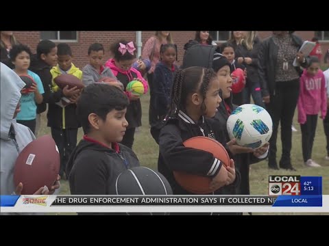 Hundreds of new sports balls donated to Wells Station Elementary School
