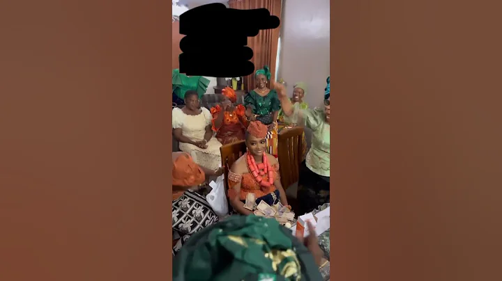 NAIJA BRIDE REFUSED TO SMILE AS TRADITION DEMANDS UNTIL HER HUSBAND ETCD GAVE HER PLENTY MONEY.