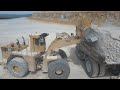 Caterpillar 992C Wheel Loader Loading Caterpillar 777F Dumpers - Interkat SA - Drone View