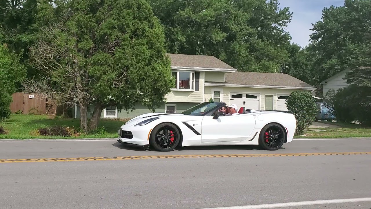 Cars leaving the 2020 Pride & Performance Car Show in Brainard