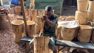 Ibrahima Barry carving the interior of a rough shell - Wula Drum