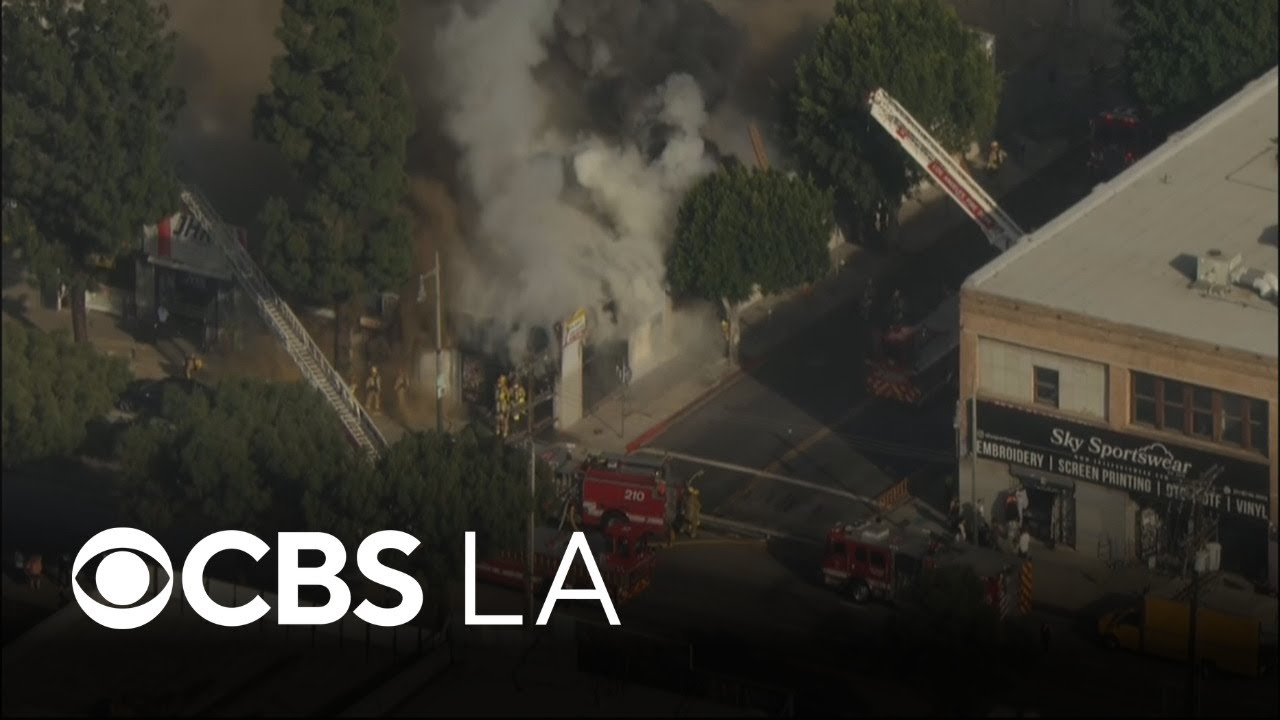 100 firefighters knock down flames at downtown LA business - YouTube