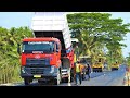 Asphalt Paving Work On Busy Road By Sumitomo HA60C Paver And Quester Dump Trucks