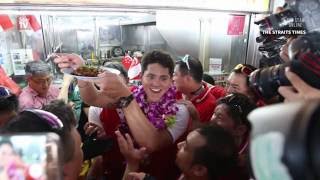 Schooling's homecoming ends with victory parade