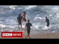 Australian surfer rescues woman from Hawaii waves - BBC News
