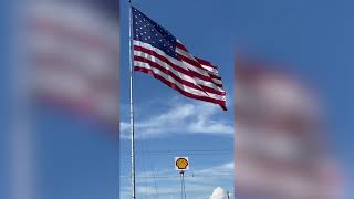Replacement 60-foot-long U.S. flag raised into position ahead of Fourth of July