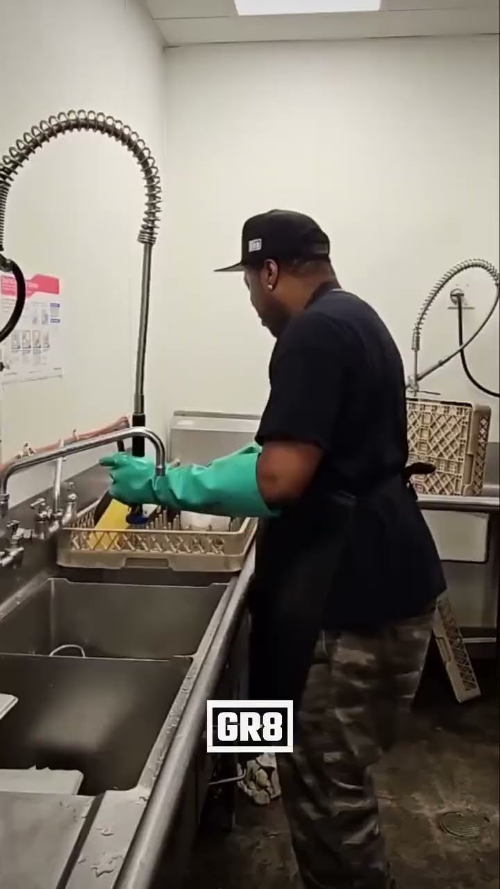 Endless Dishes: Restaurant Life's Grind Experience the hypnotic rhythm of a man's dishwashing