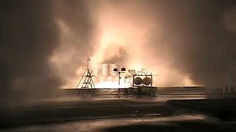 Exploding rocket engine in loading dock shoots steam and sparks 2006/02/25