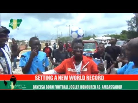Bayelsa Ball Joggler breaks new record, Drives 27 Kilometer with bicycle and ball on his head [VIDEO