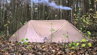 hiding in  hot tent from the rain on   ice river , bushcraft survival camping