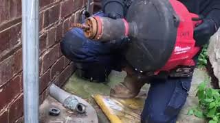Milwaukee M18 Power Feed Drain Cleaner in action