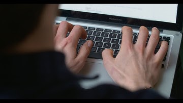 Hands Typing on a Laptop Computer Keyboard - Free Stock Video Download
