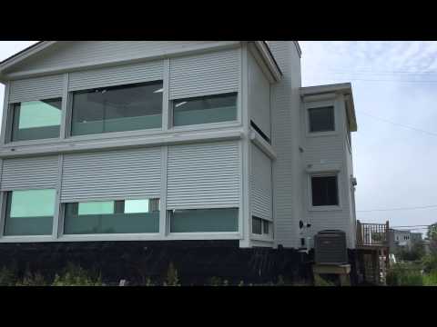 Hamptons Remote controlled exterior security and storm shutters