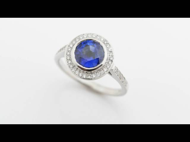 Round blue sapphire and diamond halo cluster ring video 1