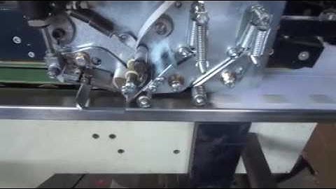 Arapak Tape applicator in a folder gluer  -double sided Finger lift tape