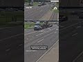 Semitruck hauling a forklift sends a utility pole flying