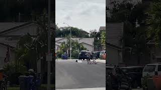 Kids ride their bike up kicker ramp in street then one boy falls forward and faceplants on pavement