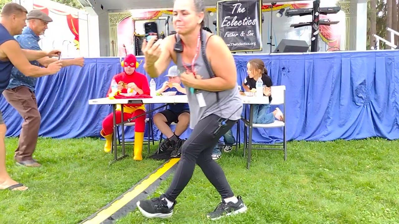 Flash gets beat by boy at "Hillbilly hamburger" eating contest.