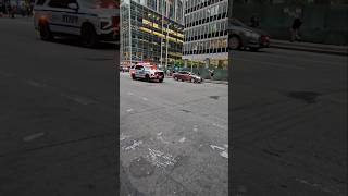 NYPD Highway Patrol Slicktop and Tahoe Passing By On 6th Ave In Midtown, Manhattan, New York City