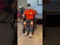 97-year-old Dad working the dumbbell in physical therapy room.