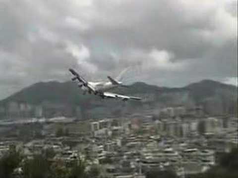 First of all, this is a collection from YouTube. I would like to thank all the enthusiasts from YouTube especially Mr. Boyd Kelly (airboyd of YouTube) which I used their best fragments to make this special Kai Tak video. Background music is from "633 Squadron" by Mr. Ron Goodwin. Kai Tak Airport VHHH (1925 - 1998) VHHX (since 1998) "traditional Chinese: åå¾·æ©å ´" was the world's busiest international airport. The growth of Hong Kong put a strain on the airport's capacity. The airport was designed to handle 24 million passengers per year but in 1996, Kai Tak had already handled 29.5 million passengers, plus 1.56 million tonnes of freight, making it the third busiest airport in the world in terms of passenger traffic, and first in terms of cargo. However extremely busy Kai Tak was located in the city center, the Kowloon City "ä¹é¾å" (The city of nine dragons "city surrounded by nine mountains"), around by high density buildings, numerous skyscrapers and rugged mountains reaching an altitude of 2000 ft. with single narrow runway (13/31) very close to taxiway jutting out into Victoria Harbour, and further less than 10 Km is Hong Kong Island, another densely populated area with hills up to 2100 ft. The only way approach to Runway 13 was a sharp 47-degree right turn before and of the same level with the checkerboard (a small hill painted with red and white checkerboard at 1:18) at about 100-meter altitude then align with the runway. Often with strong crosswinds, the airport <b>...</b>