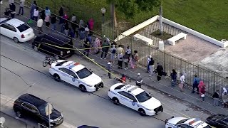 Struggling Miami families wait hours for grocery gift cards
