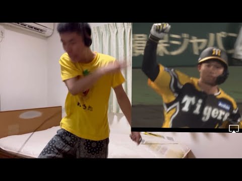 Hanshin fans celebrate after Shota Morishita wins the battle for the top spot with a two-run home...