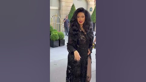 Cardi B headed to the @balenciaga show wearing a #balenciaga look and voluminous @fashionbombhair .