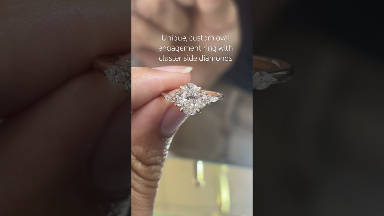Custom oval engagement ring with cluster side diamonds 