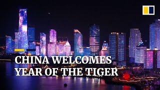 China ushers in Year of the Tiger with lights, parades and traditional Lunar New Year celebrations