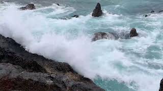 Tranquil Tide: Clear Waters, Rock Harmony, and Gentle Waves for Relaxation