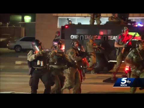 What caused the shift from peaceful protest to violence in downtown Oklahoma City?