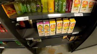 STOCKING UP FRESH JUICE IN THE DAIRY DEPARTMENT
