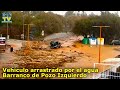 Vehculo arrastrado por el agua en el barranco de pozo izquierdo