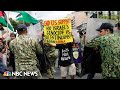 Pro-Palestinian protesters clash with police in front of the U.S. Embassy in Manila