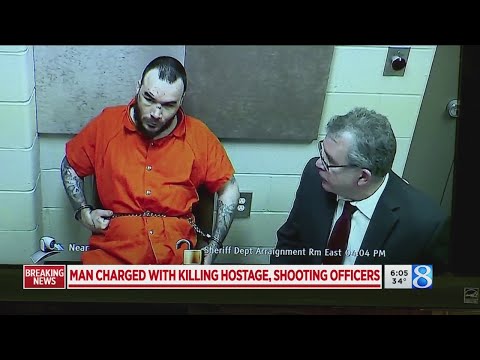 19 charges after young father killed, officers shot