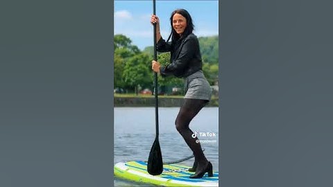 Wetlook in Shorts and Shirt in the River