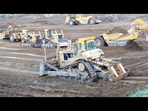 CAT D10N Dozers and 651E scrapers at work - Massive earth moving