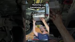 How remove a transmission pan without taking a fluid bath.