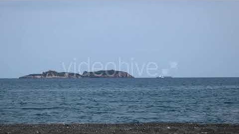 Cargo Transport Ship and Islands on Sea Horizon | Stock Footage - Envato elements