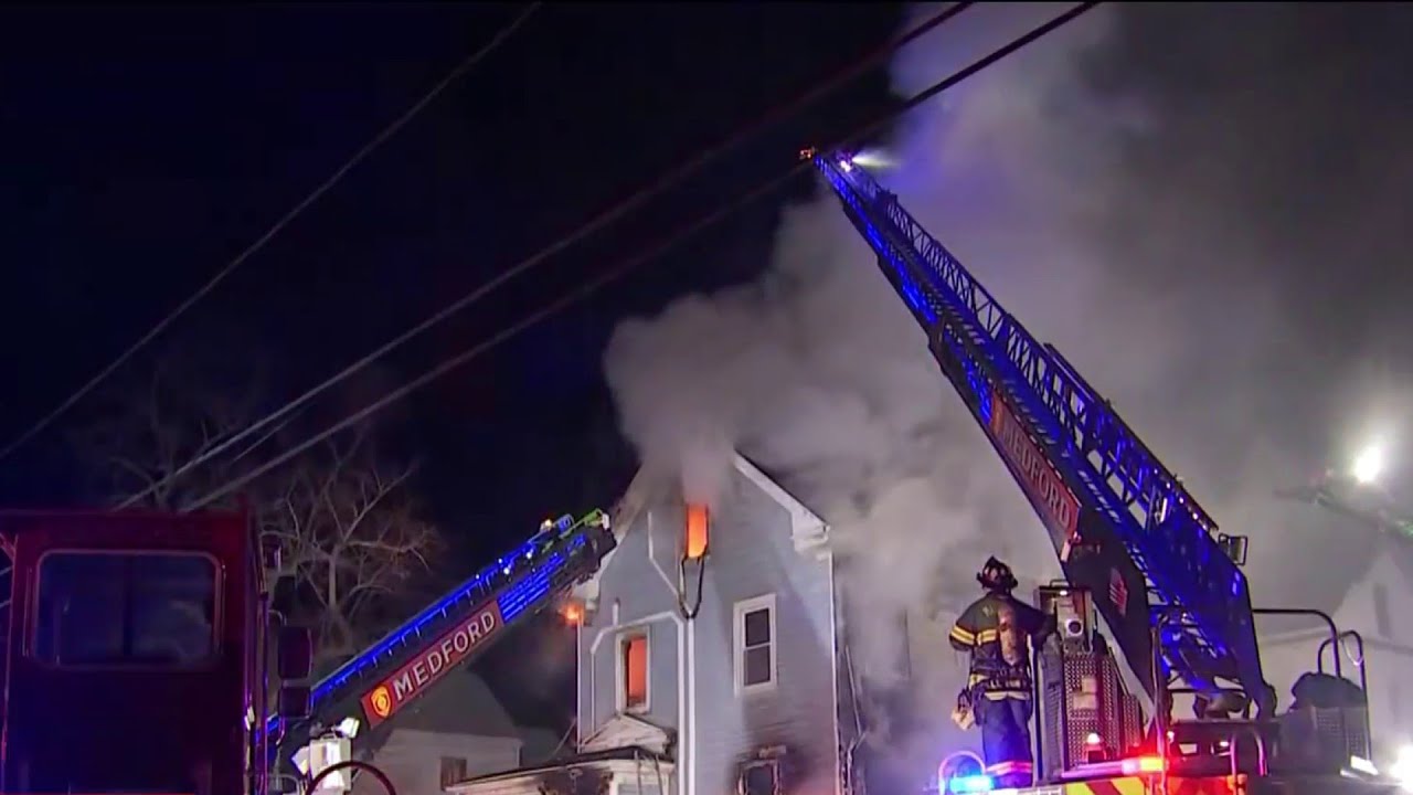 Firefighters battle flames at home in Medford
