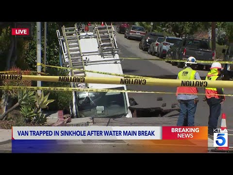 Spectrum van swallowed by sinkhole after water main break in Los Feliz