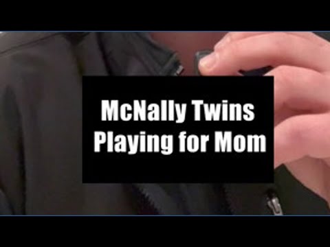 Twin sisters playing for mom at Marian University