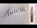 With a Japanese sharp pen, ZEBRA G, I write the name Aurora in calligraphy handwriting.