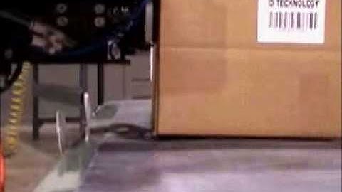 Label Printer Applicator applies label to front and side of a box