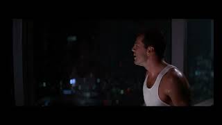 John Mcclane (Bruce Willis) does a little happy dance