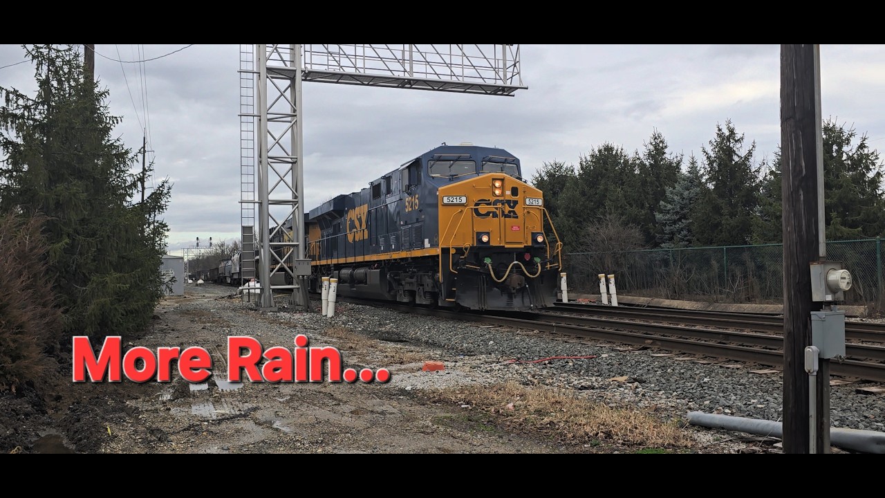 Driver Tempts Fate, Grain Train Over Filled with Corn, and More Rain